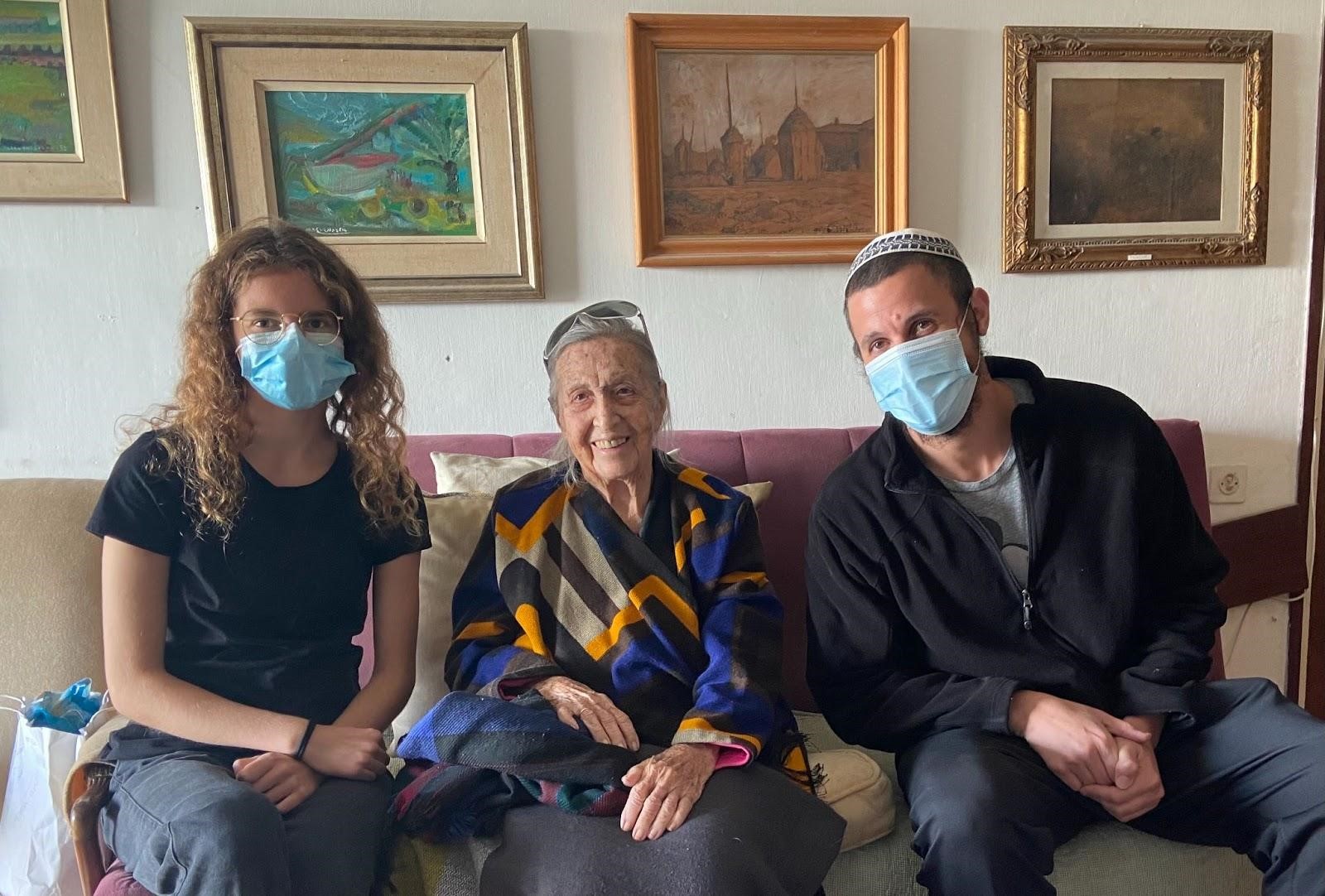 Alda at her home in Shavei Zion after the interview with volunteer Hila and research manager Ariel.