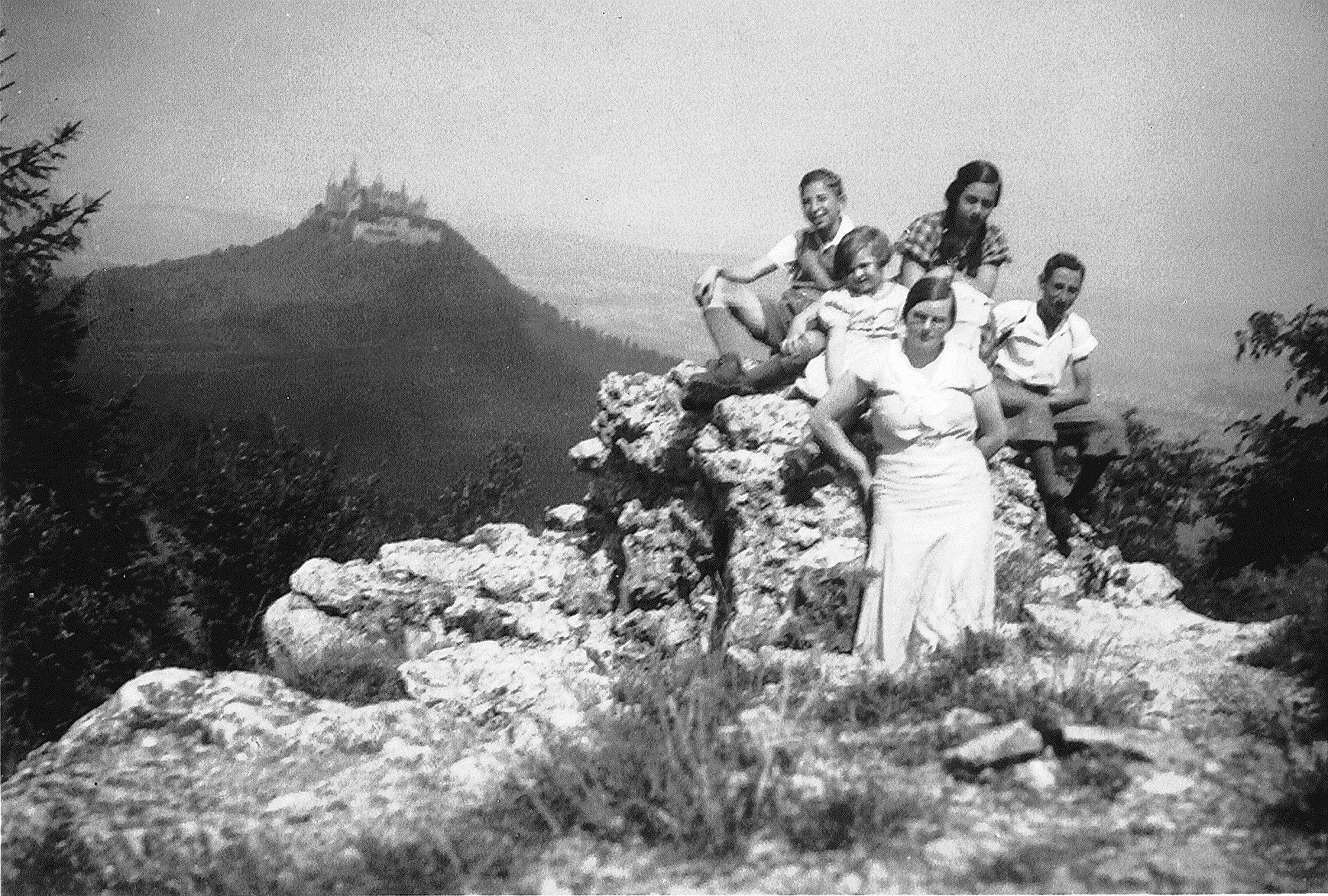 Ruth Schmalzbach (upper center) and friends on the Zeller Horn, 1937, with Castle Hohenzollern in the background.
