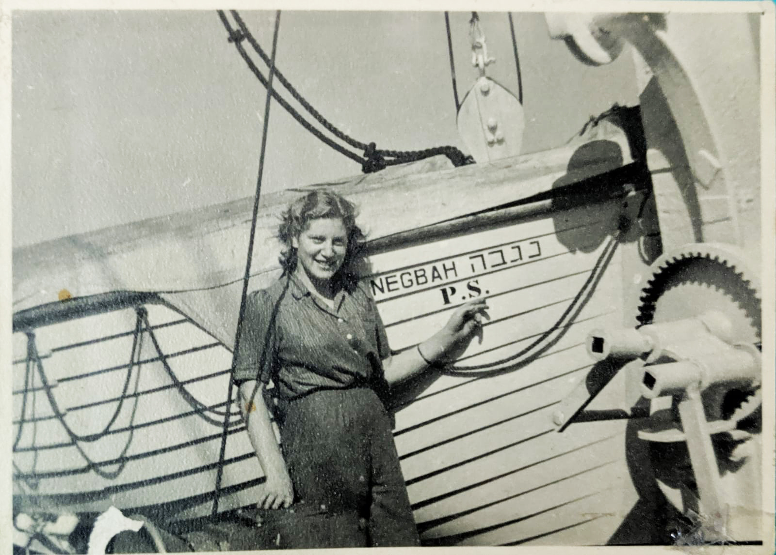 Vardit Meir with the ship on which she immigrated to Eretz Yisrael.
